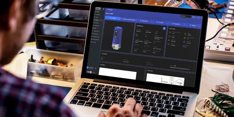 TDK SensEI product edgeRX™ dashboard opened on a laptop, being used by a maintenance worker.
