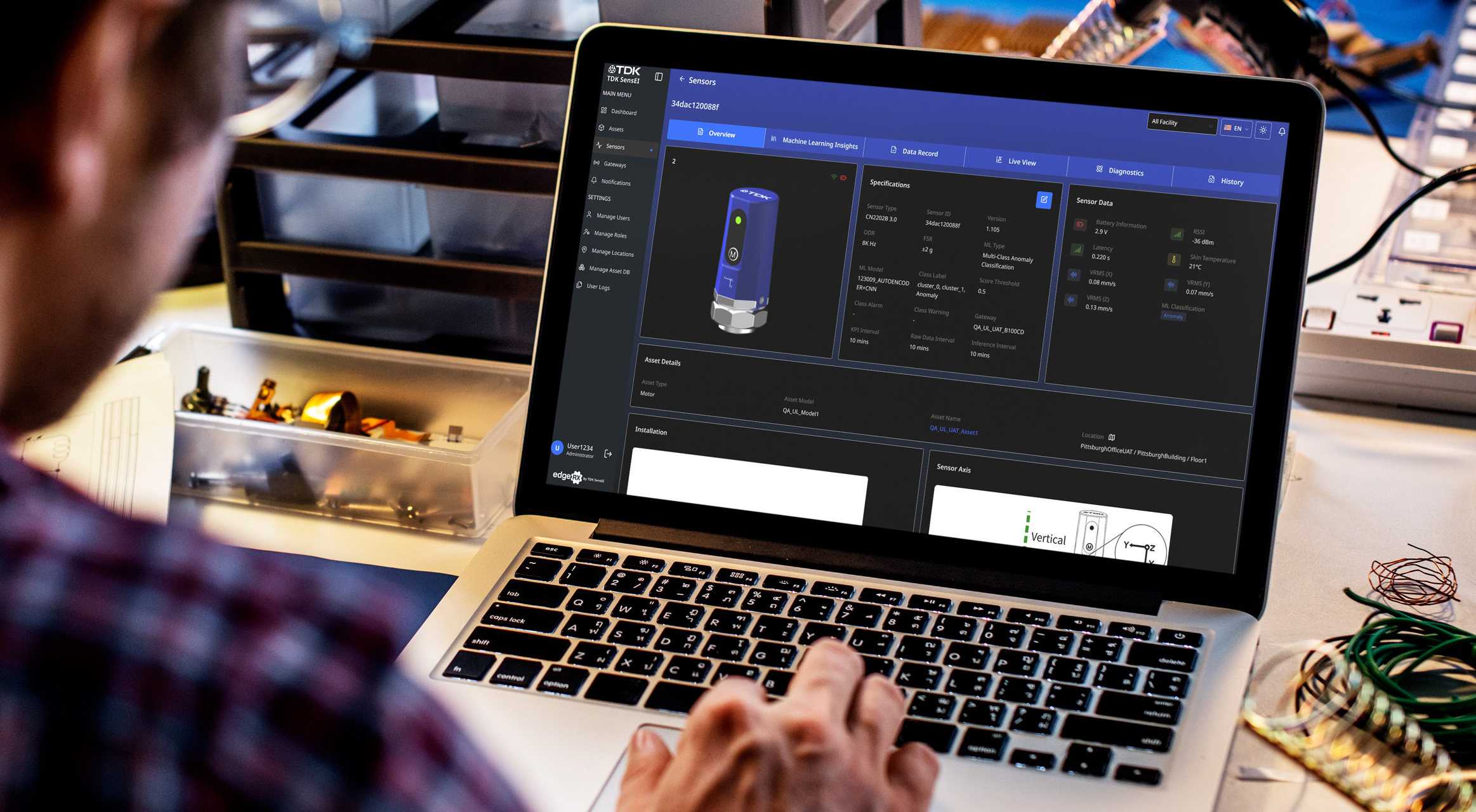 Image of a worker using the TDK SensEI Platform on his laptop computer