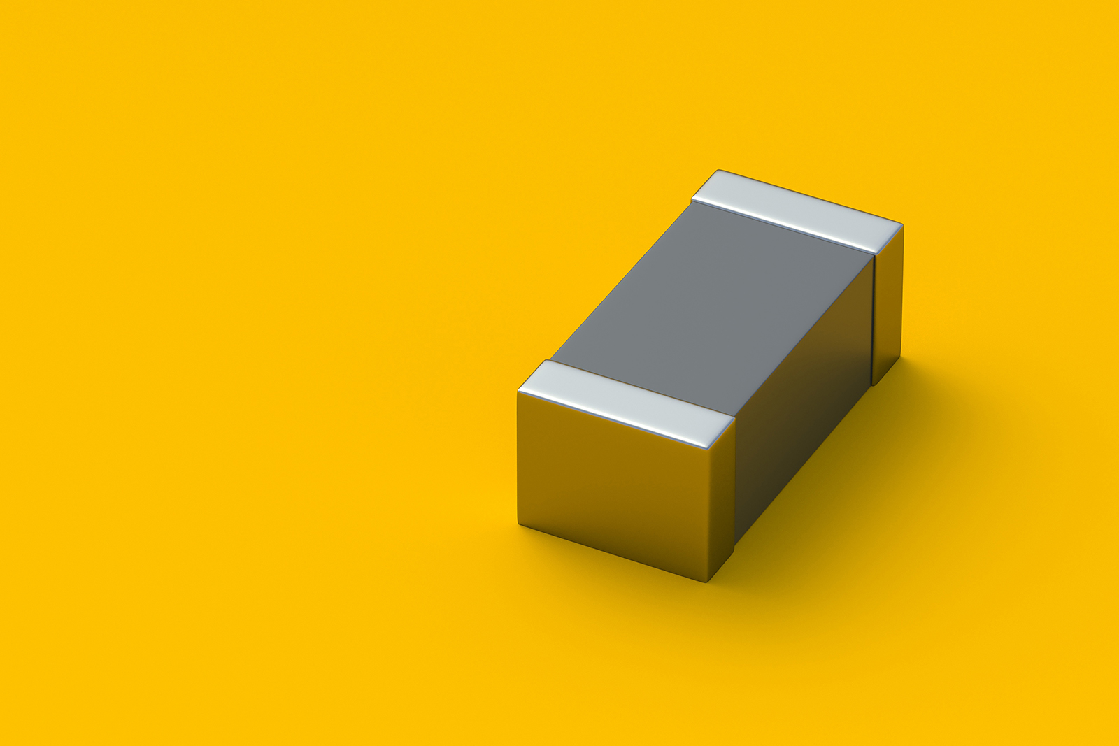 smd_capacitor_yellow_background_web Image of SMD Capacitor on a yellow background