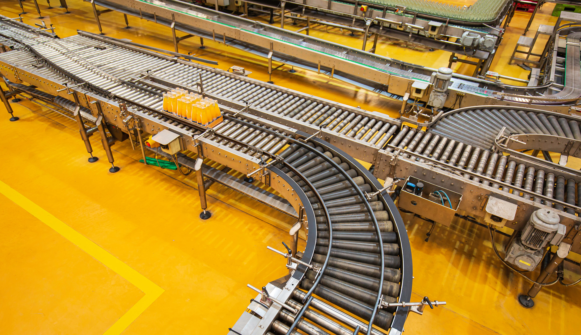 Image of a sorting conveyor system in a warehouse.